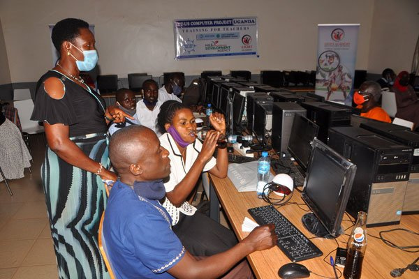Rosemary Sseninde, the State minister for Primary Education (standing)