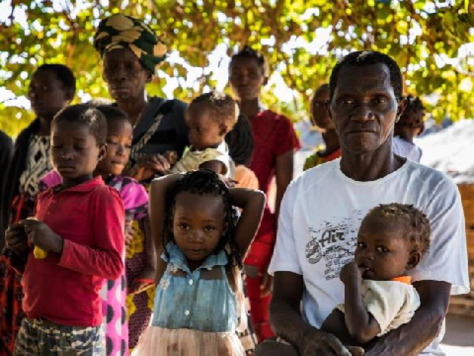 Vicente (right) heads a family of 30 people who fled the armed attacks in Mozambique