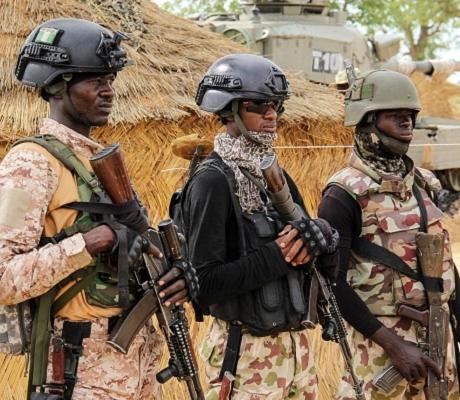 Nigerian Army soldiers stand at a base in Baga on August 2, 2019. (Photo by AUDU MARTE/AFP/Getty Ima