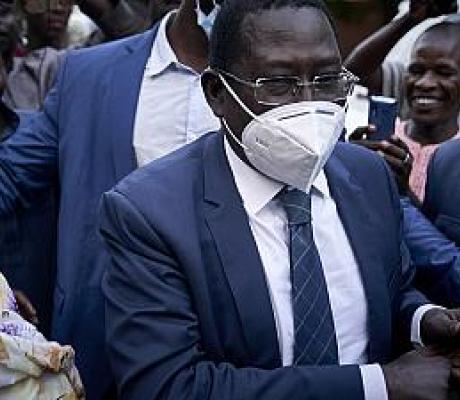 Late Malian politician Soumaila Cisse greets supporters as he arrives at his home in Bamako, on October 9, 2020, a day after his release