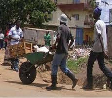 A man pushing a wheelbarrow