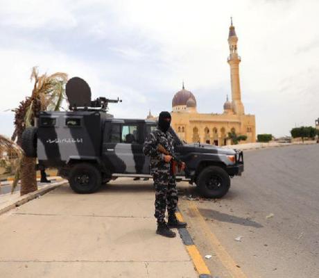 A member of security forces loyal to Libya's internationally recognised government holding a weapon