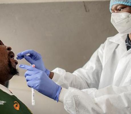 A nurse from Lancet Nectare hospital (R) performs a COVID-19 coronavirus test in Richmond