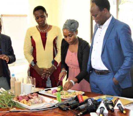 Dr Gwajima and her deputy watch as the ingredients are prepared to make a natural remedy