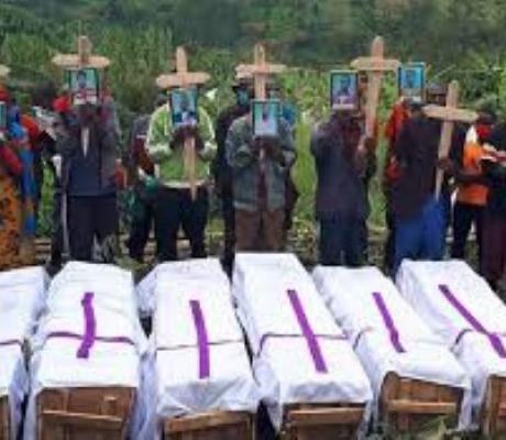 Mourners at the funeral of eight members of a family killed in landslide