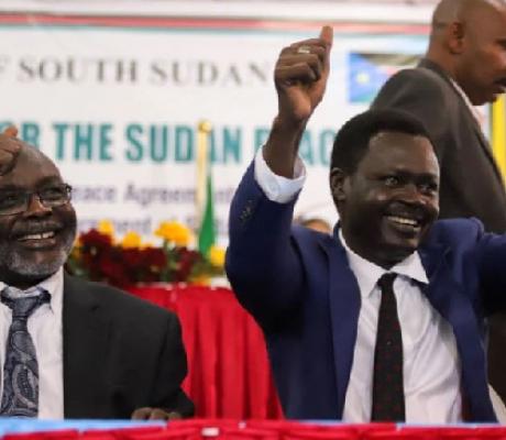 Rebels leaders gesture after the signing of the peace agreement