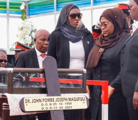 Tanzania's new President Samia Suluhu Hassan (second right) mourns beside the coffin of the late Tanzanian President John Magufuli during his national funeral at Jamhuri Stadium in Dodoma, central Tanzania on March 22, 2021.