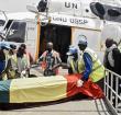 Men carry the coffin of Ould Sidati, president of the Co-ordination of Azawad Movements (CMA) onto a United Nations helicopter ahead of his burial in Timbuktu on April 16, 2021